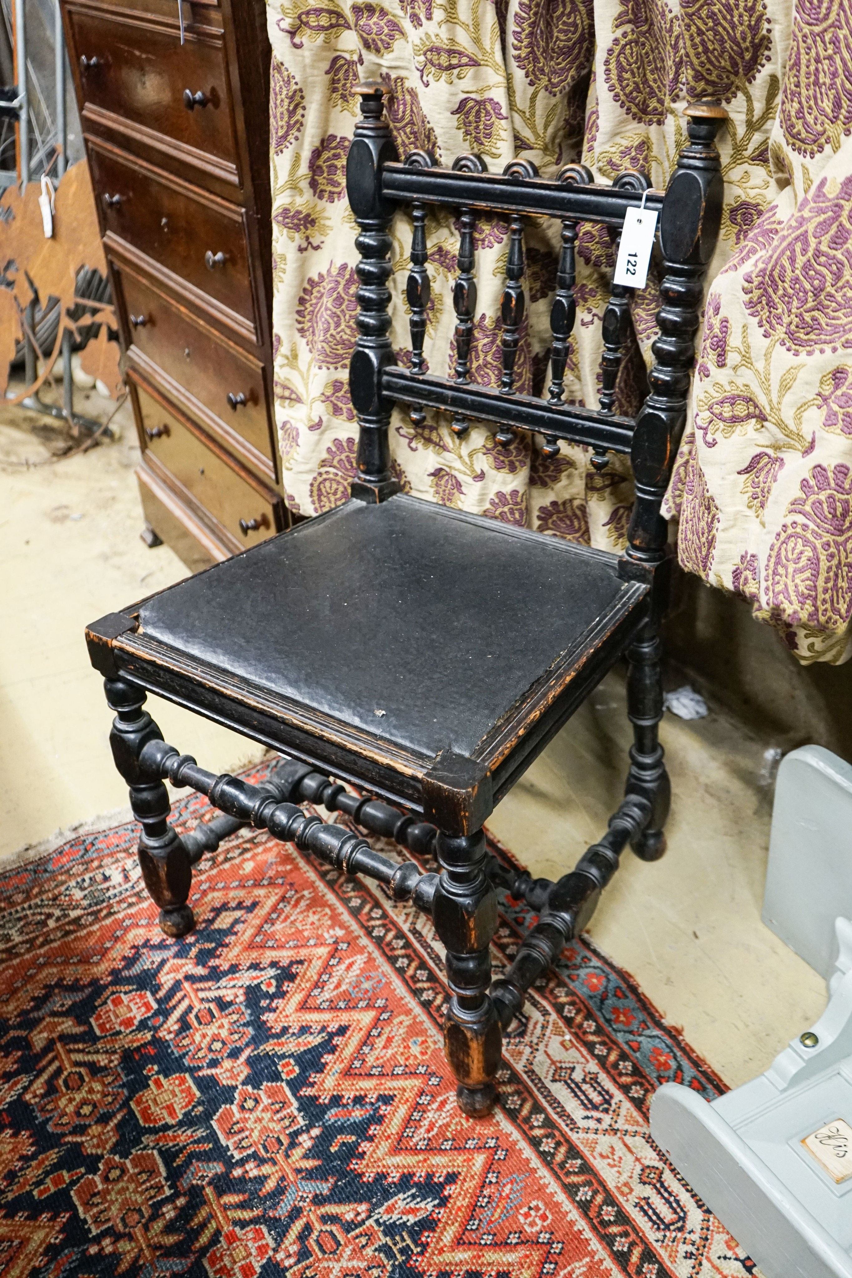 An ebonised beech chair designed by Edward Blore for Lambeth Palace. made by Gillow & Co. original oil cloth seat. Bears an ivorine plaque, 'Lambeth Palace'